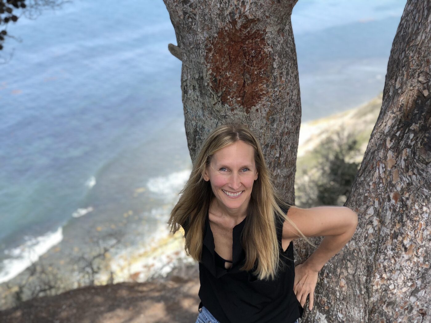 Elle Schaefer, founder of BEACON & COMPASS, outdoors by the coast